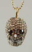 A DIAMOND SET SKULL PENDANT WITH ROSE CUT BLACK DIAMOND EYES, in silver and silver gilt, boxed. Eyes