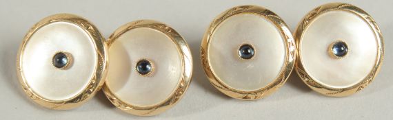 A PAIR OF ENGRAVED 18CT GOLD SAPPHIRE AND MOTHER OF PEARL CUFF LINKS.