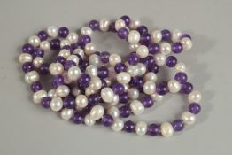 A LONG STRING OF PEARL AND l BEADS. 120cm long.