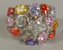 A .925 SILVER MULTI COLOURED STONE RING.