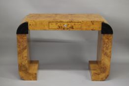 AN ART DECO DESIGN BLOND WOOD CONSOLE OR DRESSING TABLE with a single frieze drawer and curving