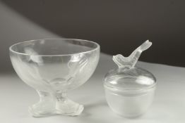 A LALIQUE CIRCULAR BOWL supported on three dolphins, 18cm diameter and A BOWL AND COVER with dolphin