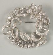A PLATINUM AND DIAMOND, APPROX. 4.5 CARATS, BROOCH, in a fitted case.