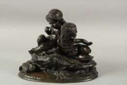 A SUPERB 19TH CENTURY BRONZE GROUP OF TWO CUPIDS on an oval base with a swan. 26cms high x 30cms