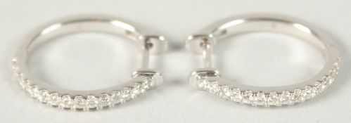 A PAIR OF 18CT WHITE GOLD AND DIAMOND HOOP EARRING.