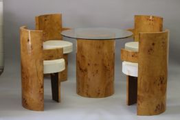 AN ART DECO DESIGN BLOND WOOD DINING TABLE SET comprising pedestal table with circular glass top and