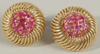 A PAIR OF 18CT GOLD AND RUBY EARRINGS.