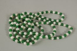 A STRING OF JADE AND PEARL BEADS. 120cms long.