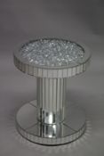A TWO TIER CIRCULAR MIRRORED TABLE. 50cm diameter 60cm high.
