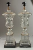 A GOOD PAIR OF WRYTHN FLUTE GLASS LAMPS on square marble bases, converted to electricity. 58cm