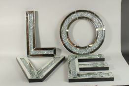 FOUR LARGE MIRRORED LETTERS 