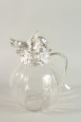 A LARGE PLAIN BULBOUS GLASS WATER JUG with silver plated boar's head and handle. 28cm high.