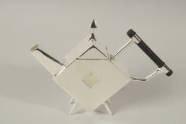 A CHRISTOPHER DRESSER DESIGN SILVER PLATED SQUARE, WITH A HOLE, TEAPOT.