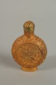 A CHINSES GILT BRONZE SNUFF BOTTLE. 8cm high.