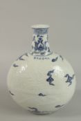A CHINESE BLUE AND WHTIE PORCELAIN CARVED DRAGON MOON FLASK. 30cm high.