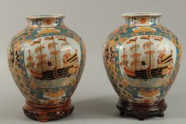 A PAIR OF CHINESE MACAU PORCELAIN VASES painted with panels of European ships, each base with
