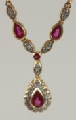 AN 18CT YELLOW GOLD, RUBY AND DIAMOND DEMI NECKLACE.