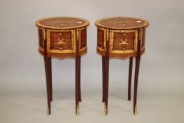 A PAIR OF LOUIS XVITH STYLE OVAL INLAID THREE DRAWER BEDSIDE CHESTS on curving feet. 40cm wide