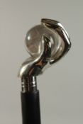 A WALKING STICK with hand and glass ball. 94cm long.
