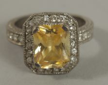 A .925 SILVER TOPAZ RING.