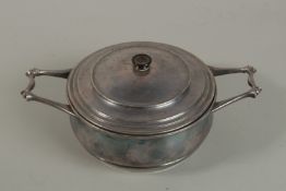 A SILVERED METAL TUREEN AND COVER by W.A.S. BENSON, the twin handles with wooden finial. Stamped: