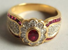 AN 18CT GOLD DIAMOND AND RUBY RING.