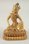 A GILDED BRONZE BUDDHA ON A LOTUS BASE, 20cm high.