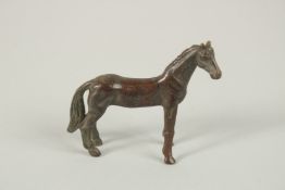 A BRONZE OKIMONO OF A HORSE.