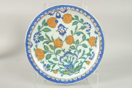 AN OTTOMAN TURKISH IZNIK GLAZED POTTERY PLATE, 30cm diameter.