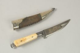 A FINE 18TH-19TH CENTURY PERSIAN WATERED STEEL BONE HILTED DAGGER, with gold inlaid calligraphy -