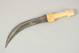 A 19TH CENTURY PERSIAN QAJAR WALRUS IVORY HILTED WATERED STEEL DAGGER, 36cm long.