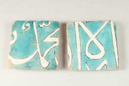TWO FINE 18TH-19TH CENTURY PERSIAN CALLIGRAPHIC TURQUOISE GLAZED TILES, approx. 14.5cm x 14cm.