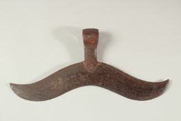 A LARGE 17TH -18TH CENTURY SOUTH INDIAN AXE HEAD, engraved and with traces of red pigment. 32cm