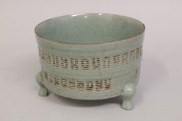 A CHINESE CELADON GLAZE CARVED PORCELAIN CENSER, with Taoist Eight Trigrams pattern, raised on three