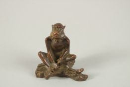 A BRONZE OKIMONO OF A MONKEY.