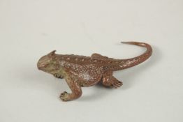 A BRONZE OKIMONO OF A LIZARD.