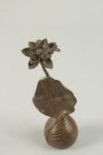 A BRONZE OKIMONO OF A LOTUS WITH DRAGONFLY, 13cm high.