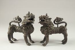 A PAIR OF BRONZE MYTHOLOGICAL BEASTS, 15cm long.