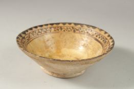 A NISHAPUR POTTERY BOWL, with painted bird motif to centre, 15.5cm diameter.