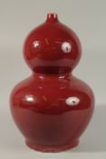 A VERY LARGE CHINESE SANG DE BOEUF DOUBLE GOURD VASE, the base with character mark, 45cm high.