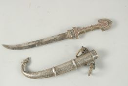 A VERY FINE 19TH CENTURY MOROCCAN KOUMMAYA DAGGER, with enamelled silver decoration, 41cm long