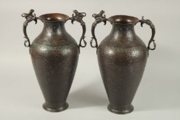 A LARGE PAIR OF 19TH CENTURY INDIAN KASHMIRI EMAMELLED COPPER TWIN HANDLE VASES, with zoomorphic