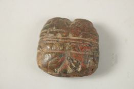 AN ANCIENT ZOOMORPHIC BRONZE OBJECT, with cat face motifs, 5.cm x 5cm.