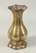 A 16TH-17TH CENTURY TIBETAN LOBED BRASS VASE, 22.5cm high.