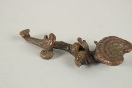 A BRONZE OKIMONO OF A MUSHROOM RUYI SCEPTER.