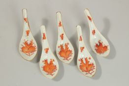 A COLLECTION OF FIVE CHINESE COPPER RED AND WHITE PORCELAIN SPOONS, with pomegranate and bat design,