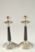 A FINE PAIR OF ORIENTAL SILVER CANDLESTICKS, with engraved and chased dragon decoration to the