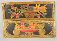 A PAIR OF DECORATIVE CARVED WOODEN PANELS, depicting flora and fruit with gilded borders, 98cm x