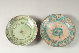 TWO KASHAN GLAZED POTTERY DISHES, 18.5cm and 17cm diameter.