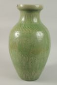 A LARGE CHINESE CELADON GLAZED CARVED VASE, 43cm high.
